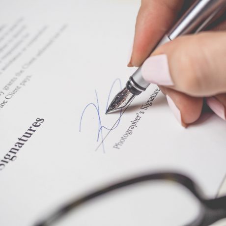 Woman signing a contract